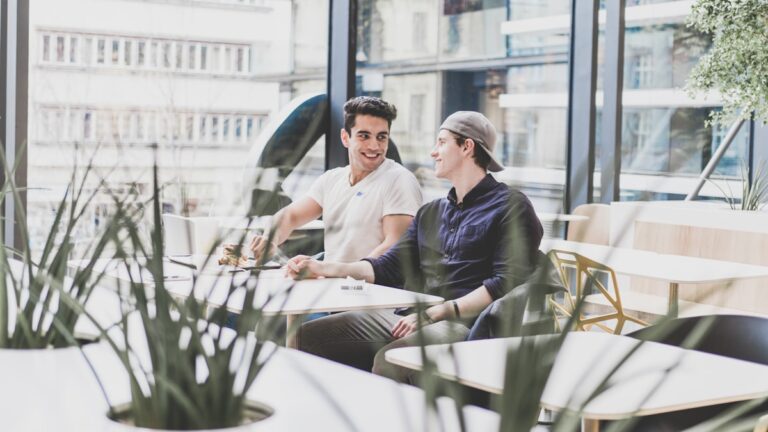 Collaborative divorce depicted as two people negotiating calmly at a table