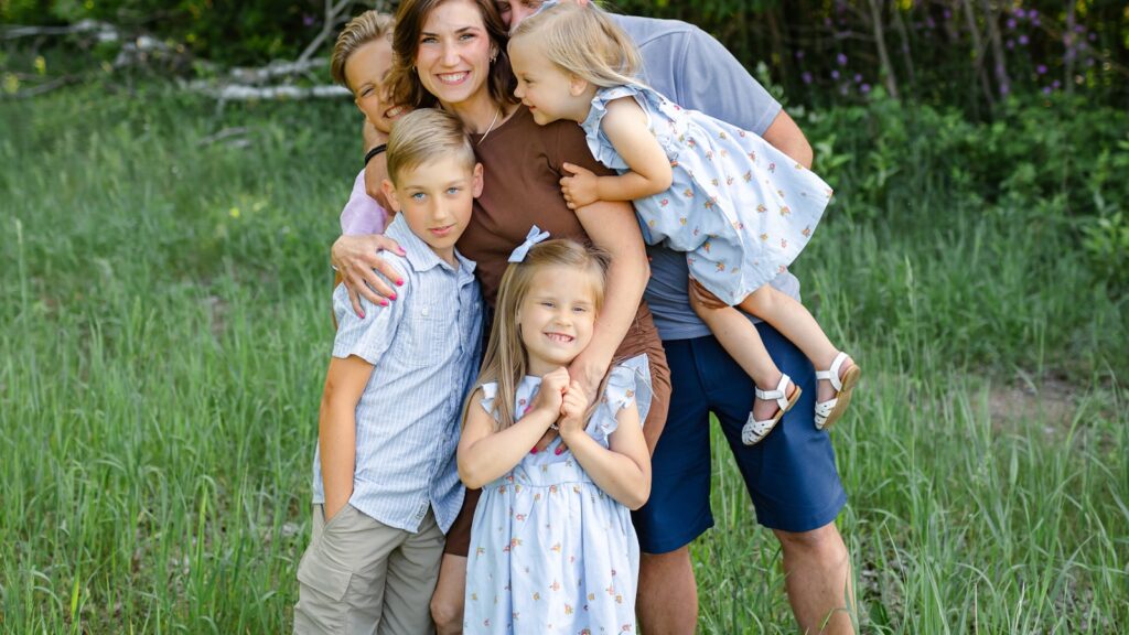 Loyalty binds in blended families: a family posing together outdoors in a field