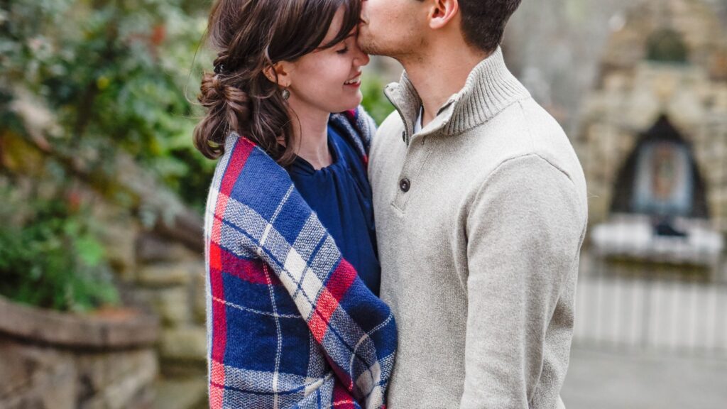 A couple embracing, negative sentiment override in marriage