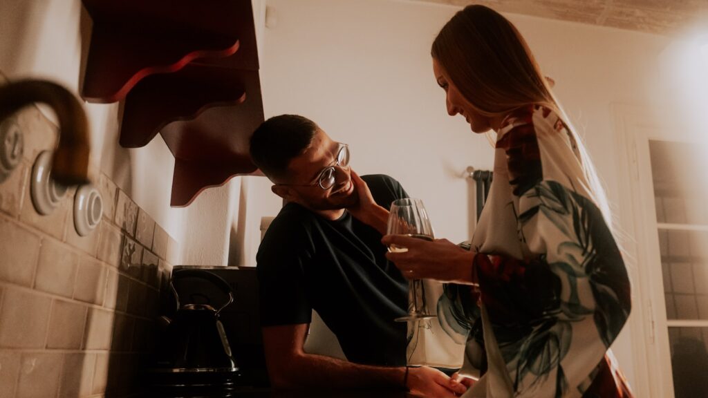 Stress spillover in marriage: a man and a woman standing quietly in their kitchen