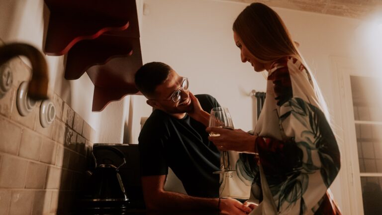 Stress spillover in marriage: a man and a woman standing quietly in their kitchen
