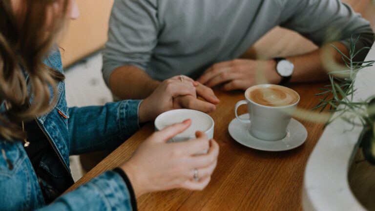 The 36 questions to fall in love: two people in deep conversation on a first date