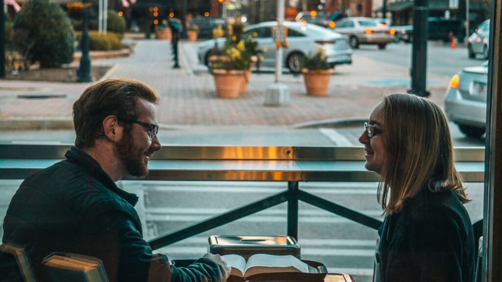 Man and woman sitting and talking together