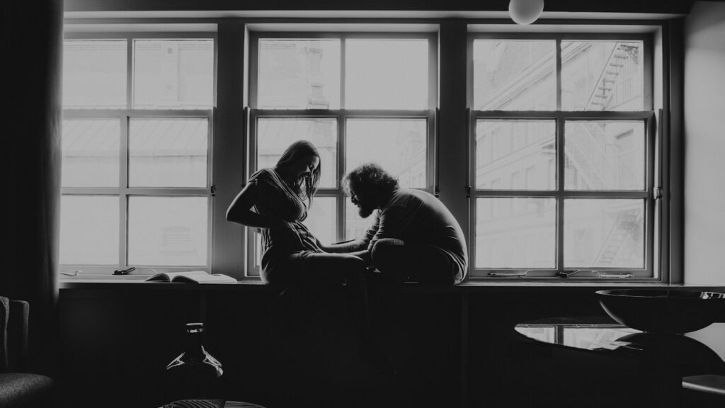 Couple seated apart, showing the anxious avoidant relationship trap