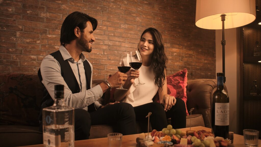 Couple sitting on a couch discussing how they connect