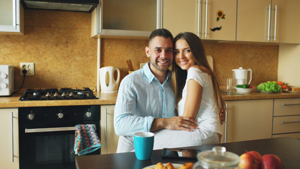 Couple talking openly in their kitchen, building trust in a relationship