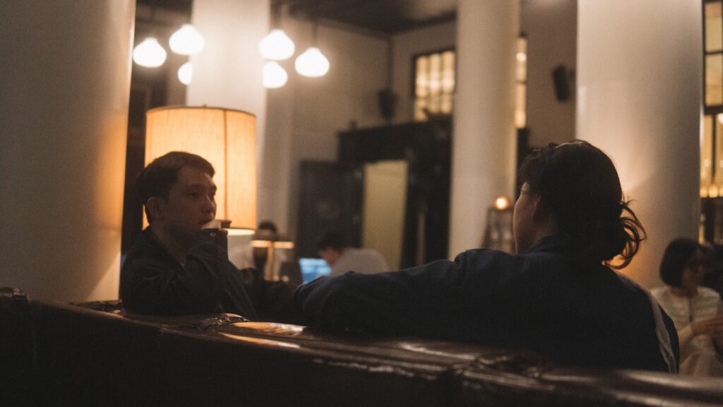 Two adults having a calm conversation about ending their marriage
