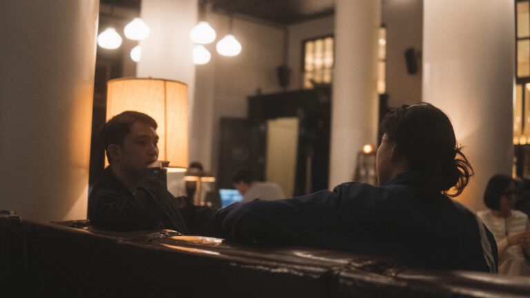 Two adults having a calm conversation about ending their marriage