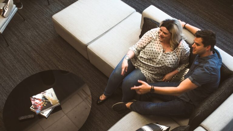 Couple sitting side by side in discernment counseling