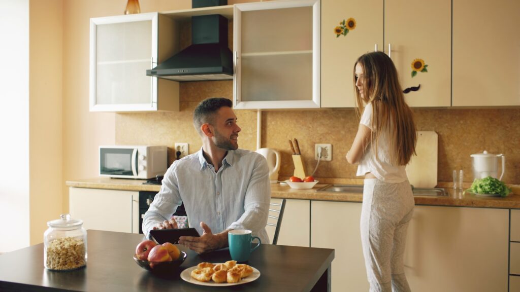 Married couple talking at breakfast about desire discrepancy in marriage