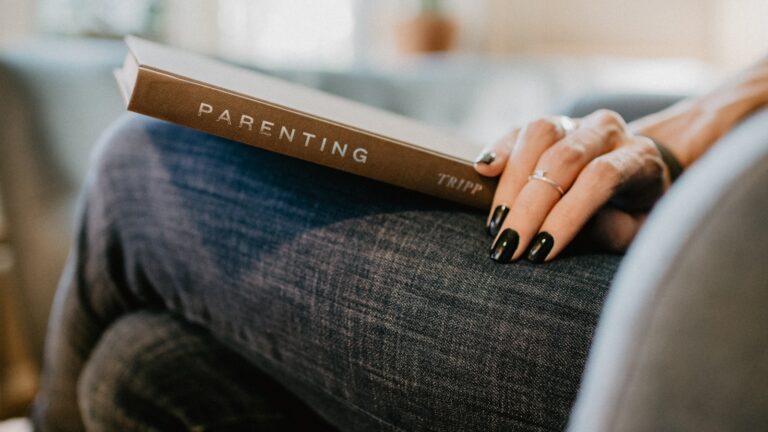 Praising kids the right way: a parent encouraging a child working on a task