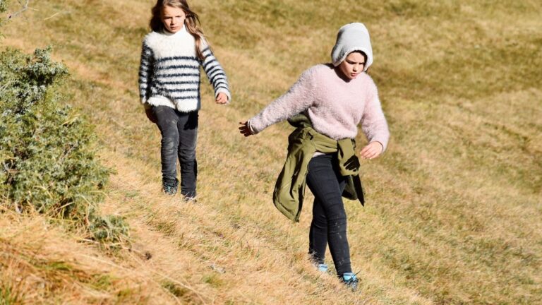 Parent and child walking outdoors while navigating a rebound relationship after divorce