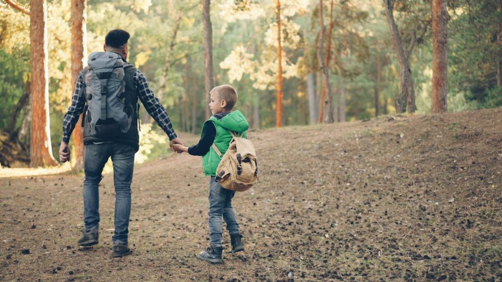 A parent and child on a hike, a calm way of introducing a new partner after divorce