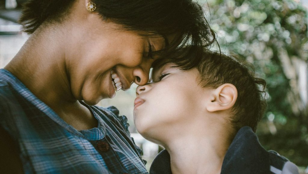 A parent and child staying close while adjusting to two homes after divorce