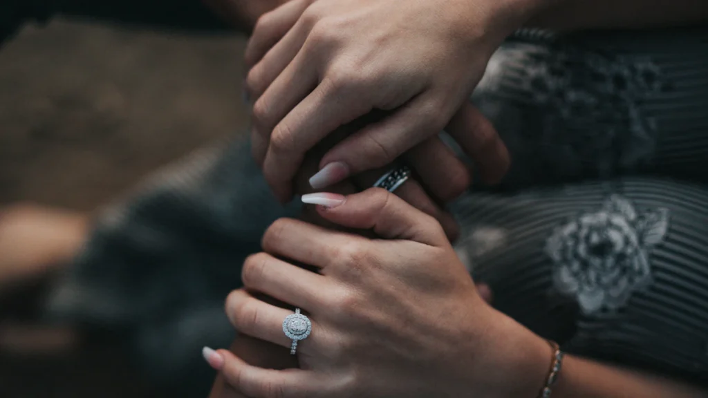 Engaged couple holding hands after premarital counseling