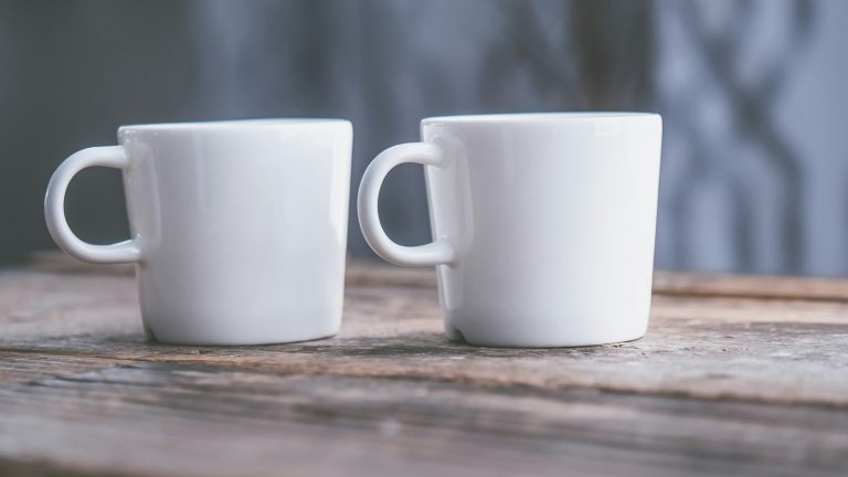 Two white teacups on a table, a quiet moment to tell your spouse you want a divorce